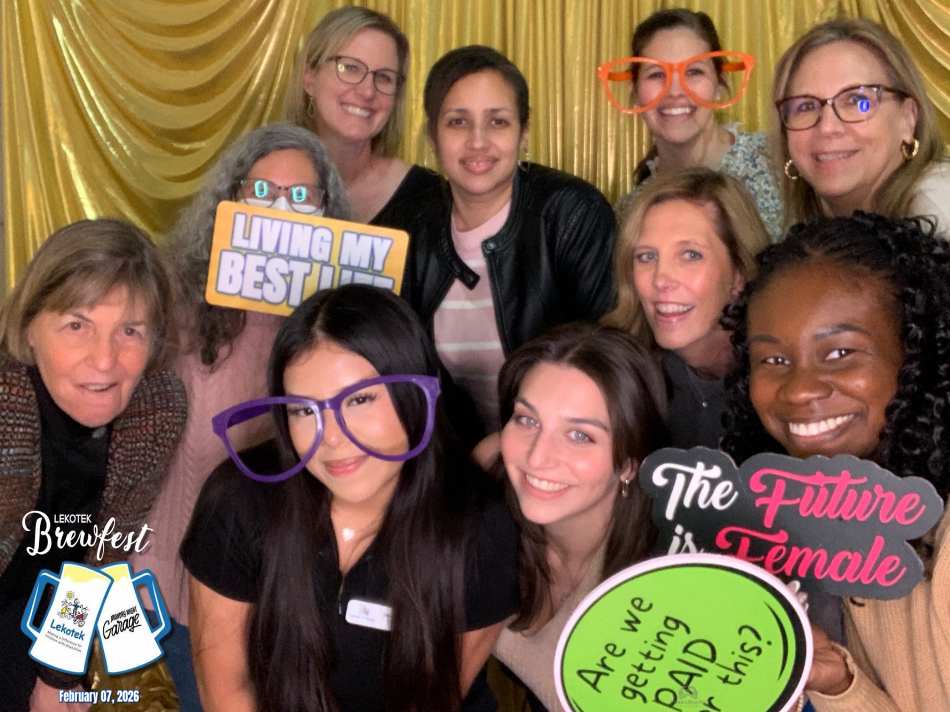Large group photo with branded overlay from the open-air booth at Lekotek Brewfest