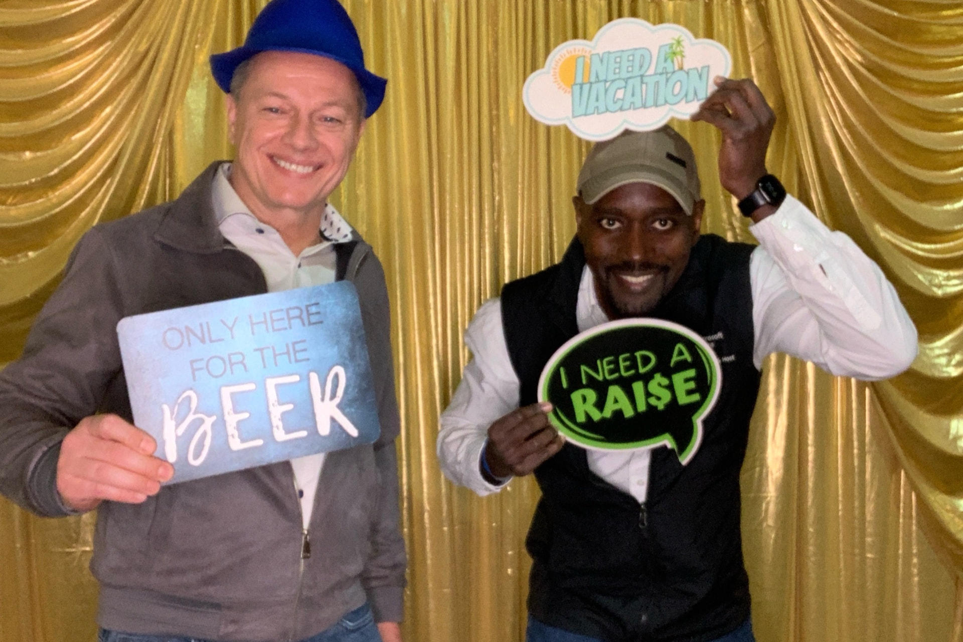 Guests with hats and props at a Brewfest open-air booth activation