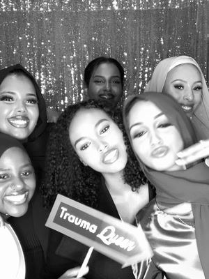 Black and white group photo at a Trauma Queen themed party