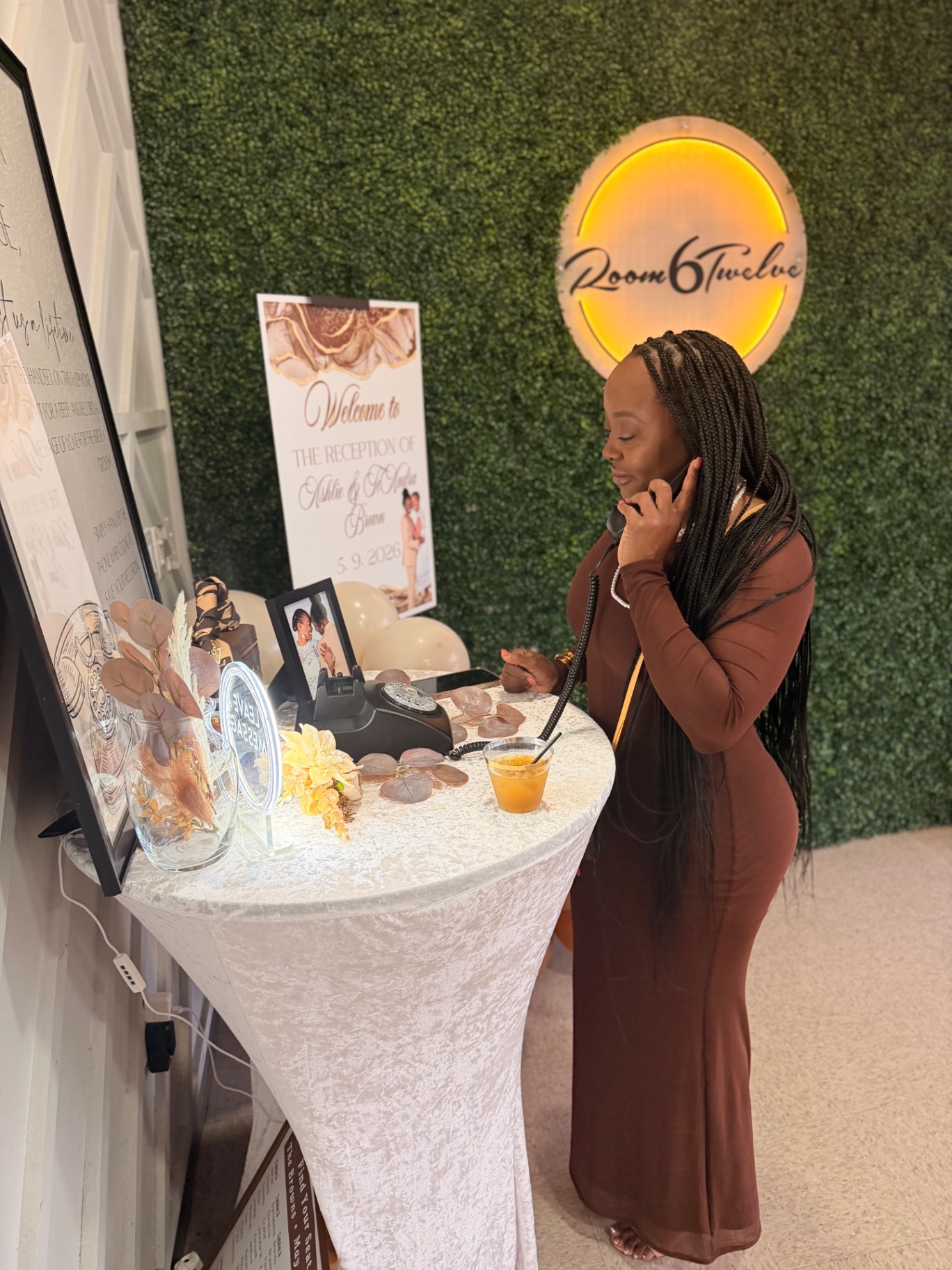 Wedding guest leaving a voice message at the audio guestbook table
