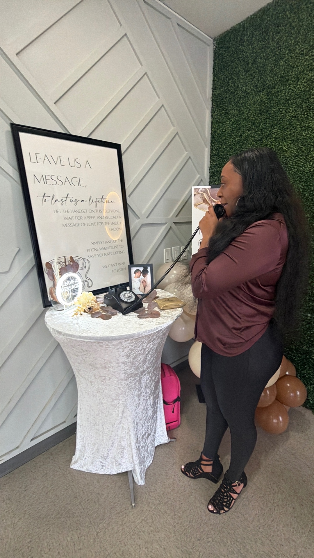 Guest recording a message on the audio guestbook phone at a wedding reception